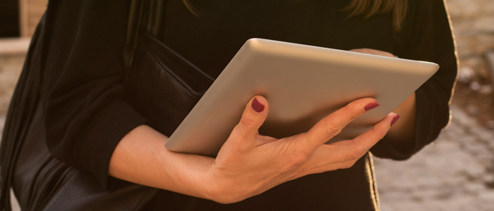 woman holding ipad